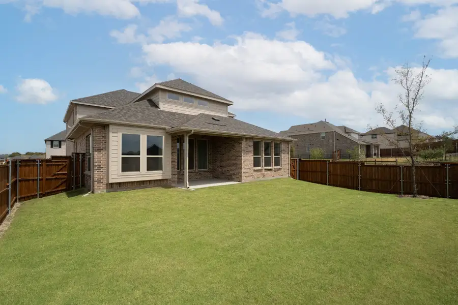 Exterior details and patio area of a home in Enclave at Legacy Hills, Celina (Image 2).