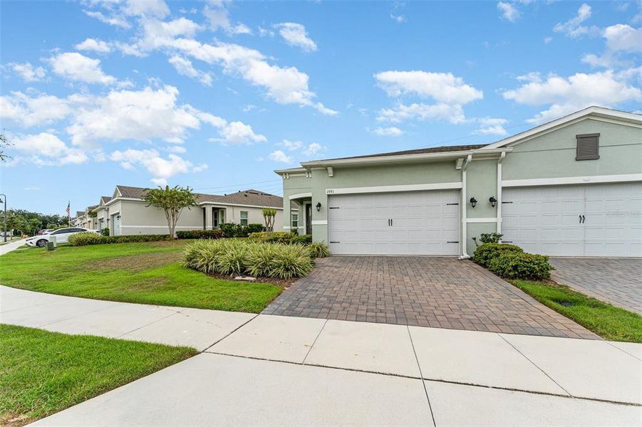 Front exterior of a new home in , Kissimmee, FL, highlighting curb appeal (Image 22).