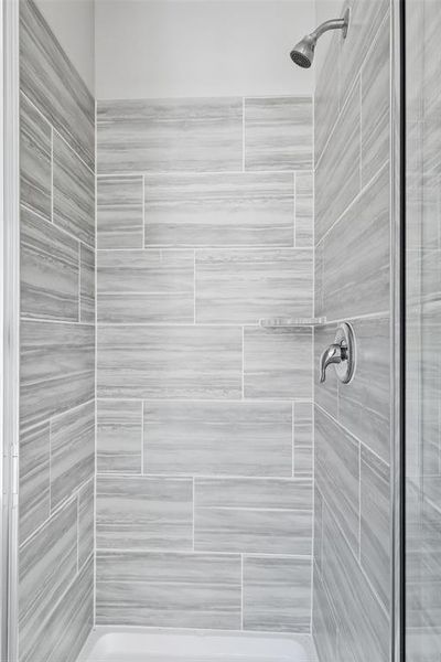 Full bathroom featuring a stall shower Full bathroom featuring a stall shower