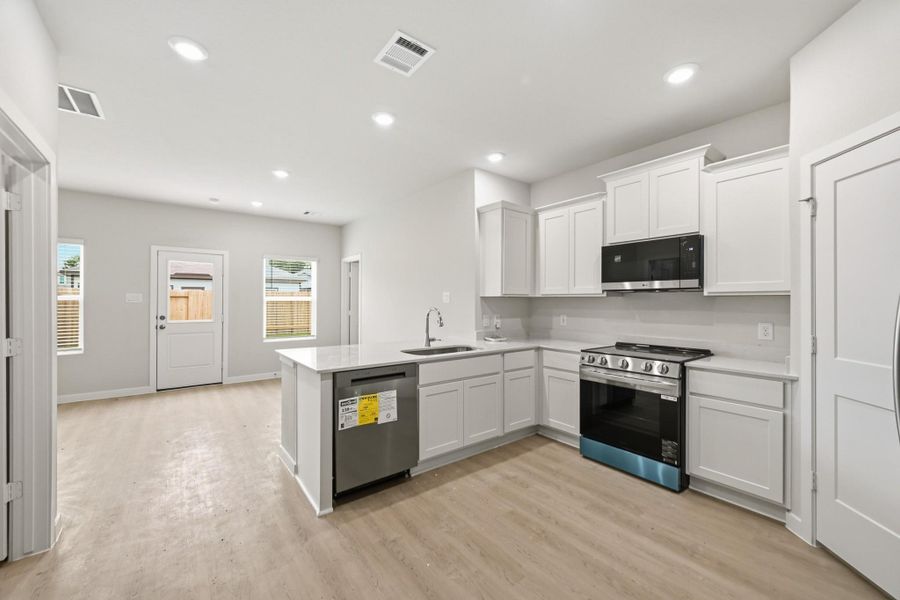 Furnished interior view inside a new home in Crockett Meadows, Conroe (Image 5).