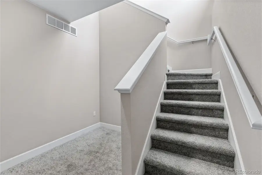 Spacious, unfurnished interior of a new home in The Cottages Collection at Ridgeline Vista, Brighton (Image 9).