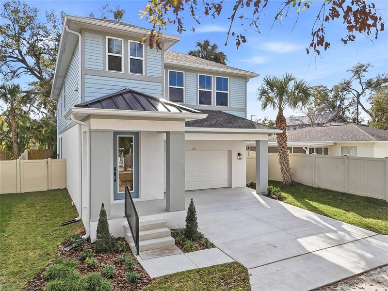 Front exterior of a new home in , Tampa, FL, highlighting curb appeal (Image 24).