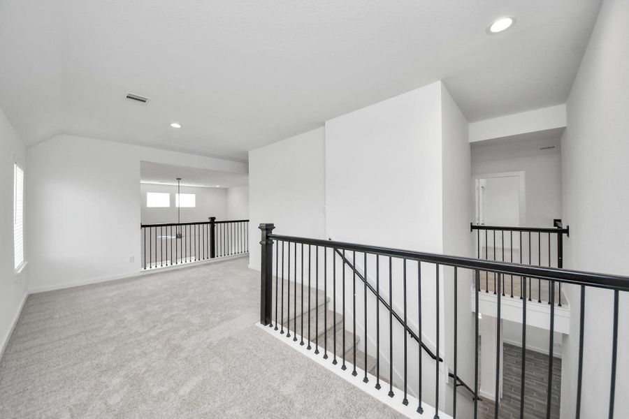 Ascend to relaxation in this fantastic game room! Ideal for both casual gatherings and adult gaming, it boasts plush carpet, lofty ceilings, custom paint, and ample windows for abundant natural light Ascend to relaxation in this fantastic game room! Ideal for both casual gatherings and adult gaming, it boasts plush carpet, lofty ceilings, custom paint, and ample windows for abundant natural light