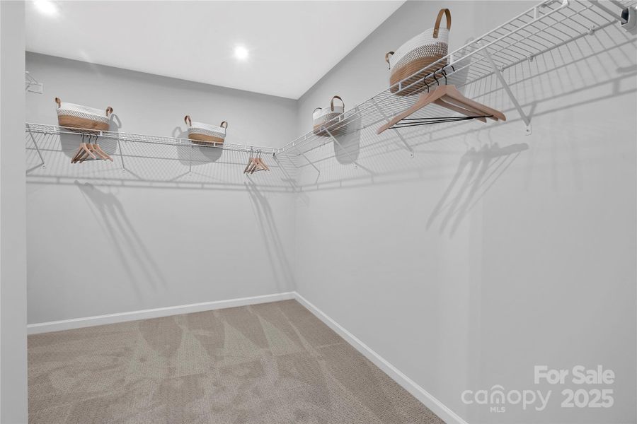 Large primary walk-in closet.