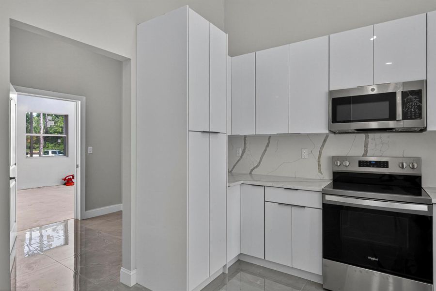 Furnished interior view inside a new home in , The Acreage (Image 16). Furnished interior view inside a new home in , The Acreage (Image 16).