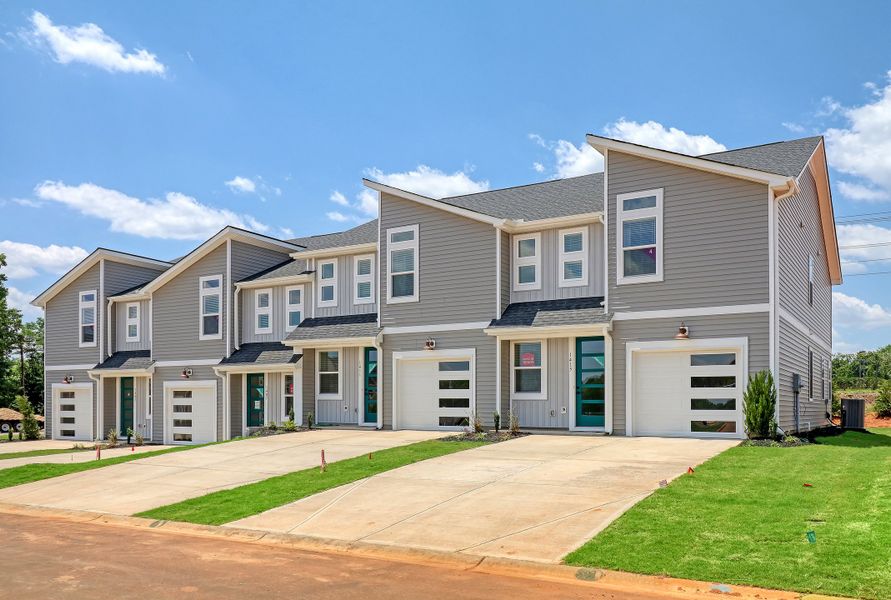 Representative exterior photo of a completed home built from the Ivey by Hunter Quinn Homes in Westgate Village Townes, Spartanburg, SC (Image 23). Representative exterior photo of a completed home built from the Ivey by Hunter Quinn Homes in Westgate Village Townes, Spartanburg, SC (Image 23).