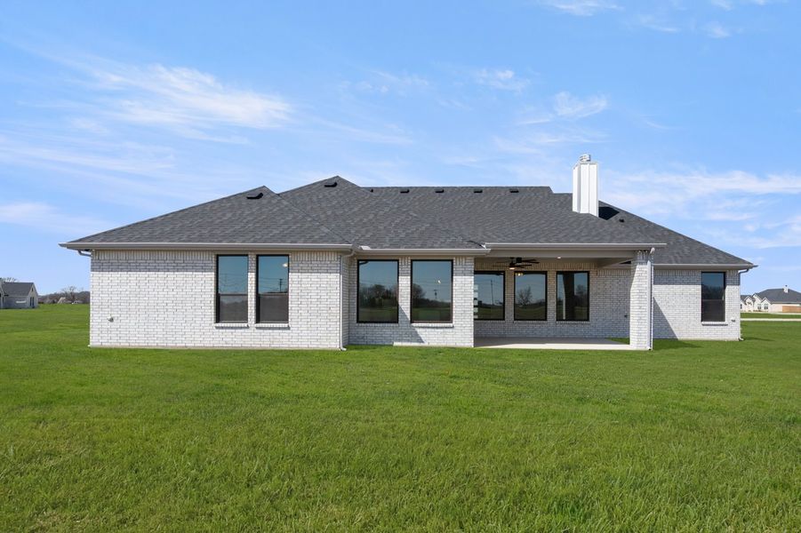 Front exterior of a new home in Estates of Palmer, Waxahachie, TX, highlighting curb appeal (Image 27). Front exterior of a new home in Estates of Palmer, Waxahachie, TX, highlighting curb appeal (Image 27).