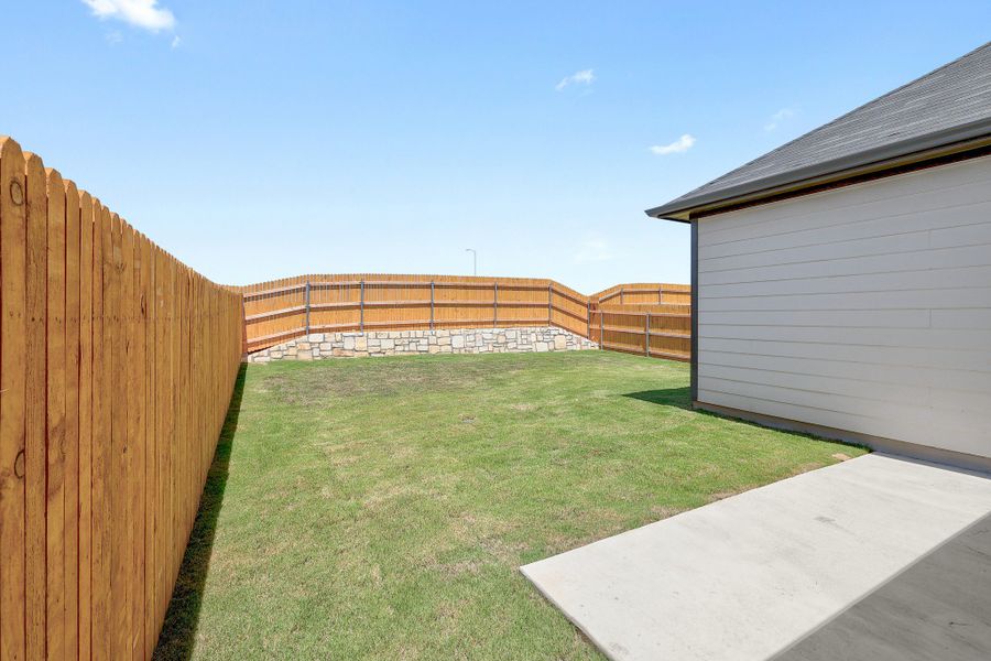 Exterior details and patio area of a home in Trinity Ranch, Elgin (Image 21).