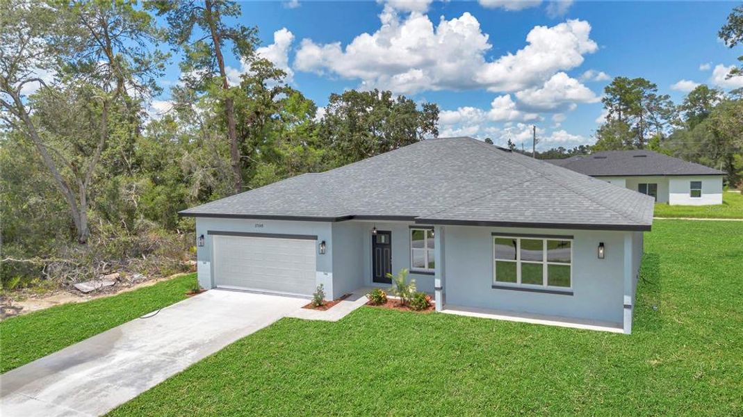 Front exterior of a new home in , Ocala, FL, highlighting curb appeal (Image 24).