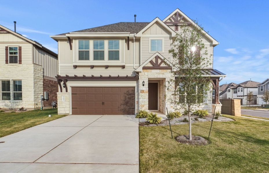 Front exterior of a new home in Saddleback at Santa Rita Ranch, Liberty Hill, TX, highlighting curb appeal (Image 2). Front exterior of a new home in Saddleback at Santa Rita Ranch, Liberty Hill, TX, highlighting curb appeal (Image 2).