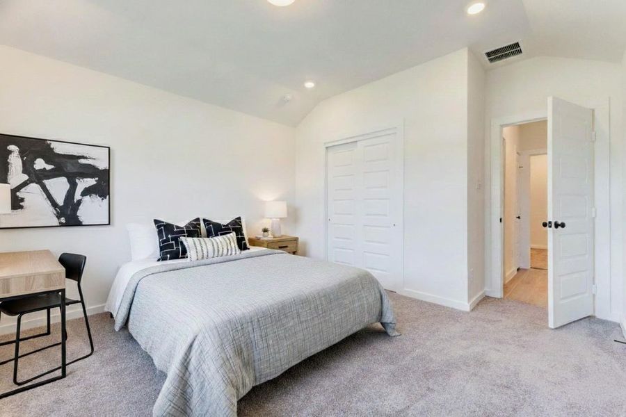 Well-sized secondary bedroom with closet, neutral finishes, and natural light. This photo has been virtually staged for visual reference.