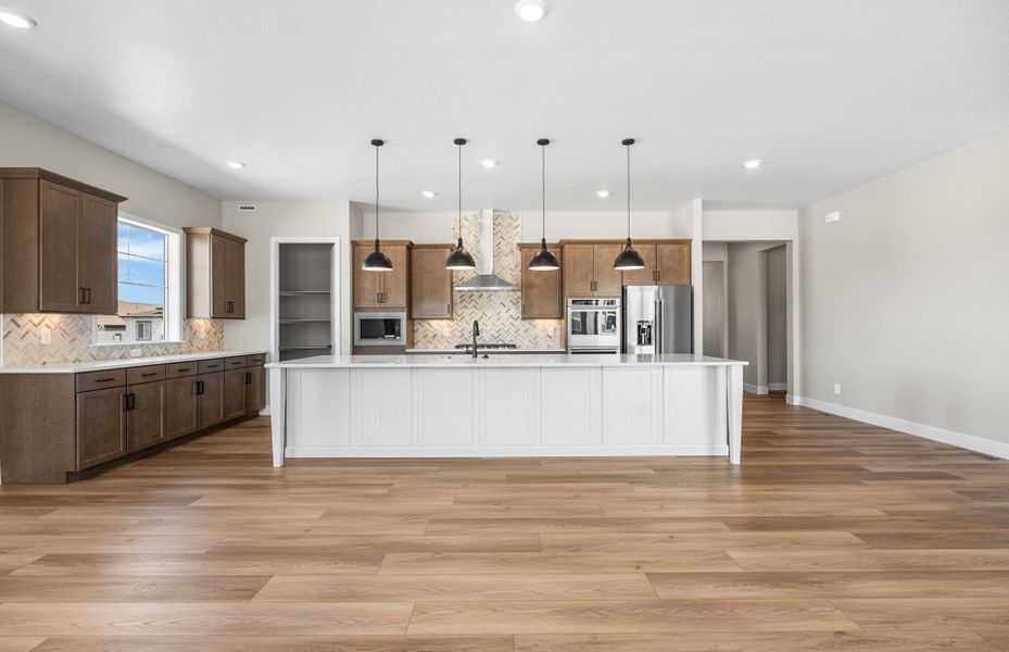 Furnished interior view inside a new home in Hilltop at Inspiration, Aurora (Image 7).