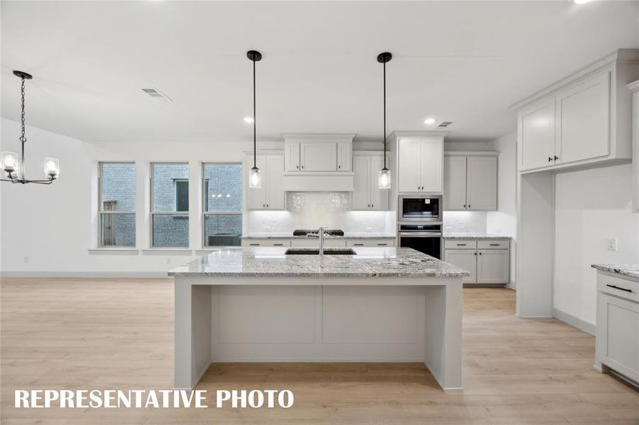 Offering outstanding storage and prep space, the chef inspired kitchen in our Orleans plan is a dream come true!  REPRESENTATIVE PHOTO