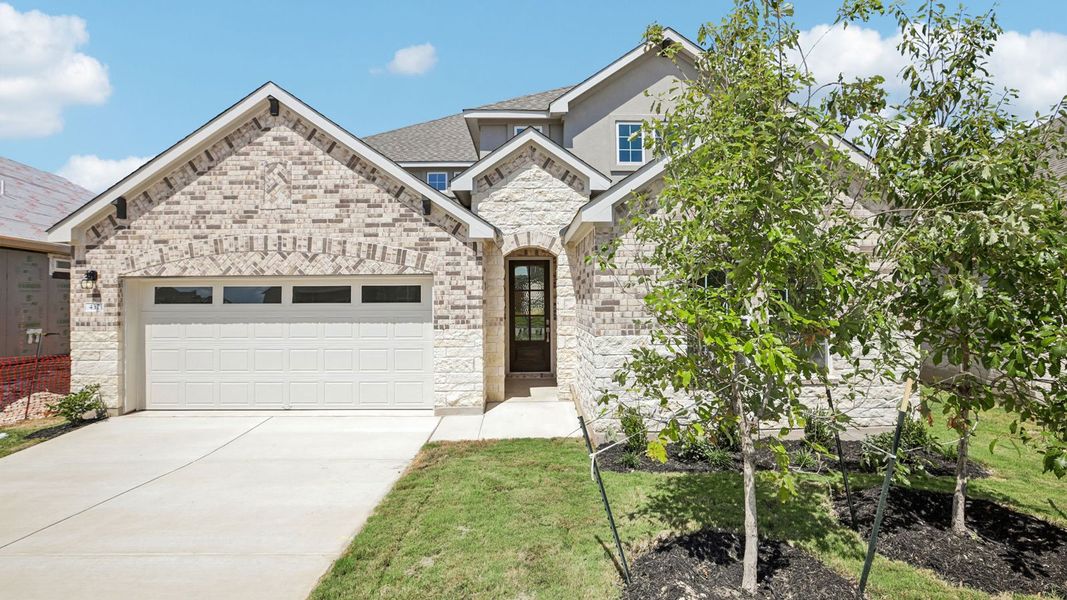 Front exterior of a new home in Rosenbusch Ranch, Leander, TX, highlighting curb appeal (Image 2).