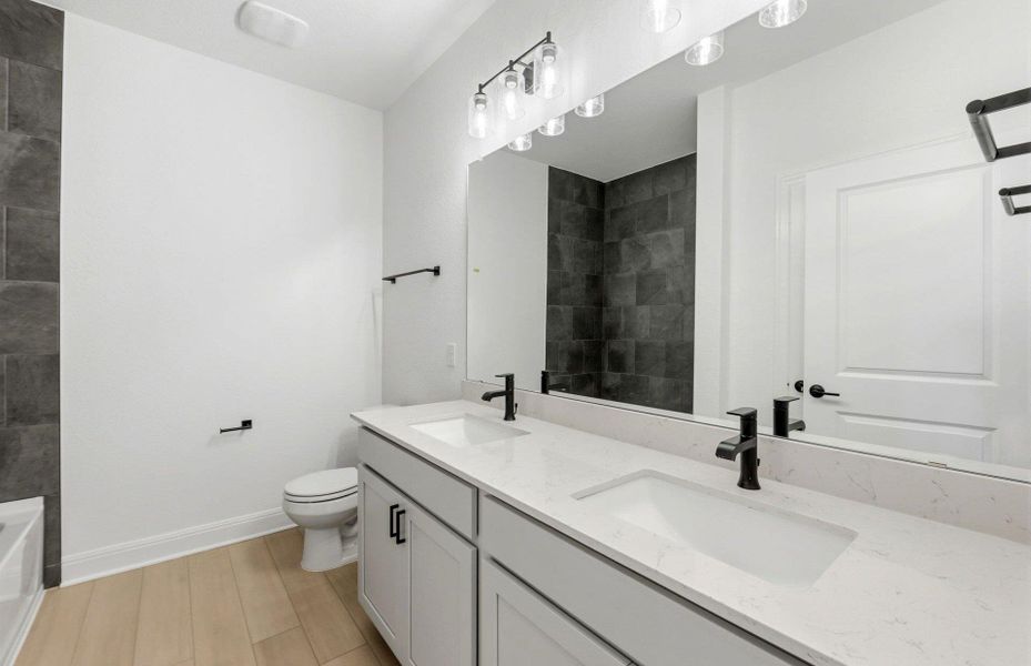 Furnished interior view inside a new home in West Cypress Hills, Spicewood (Image 12).