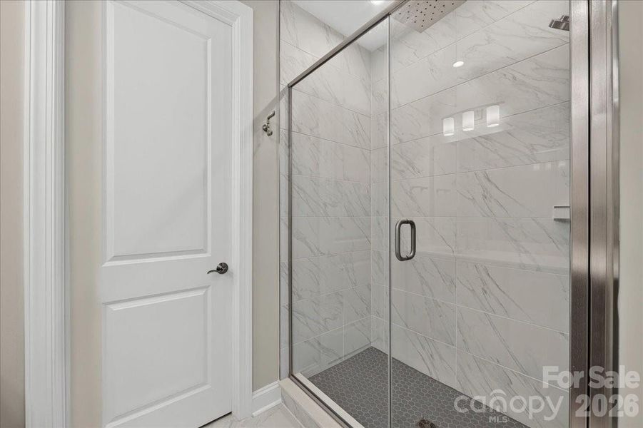 Primary bathroom with tiled walk-in shower Primary bathroom with tiled walk-in shower