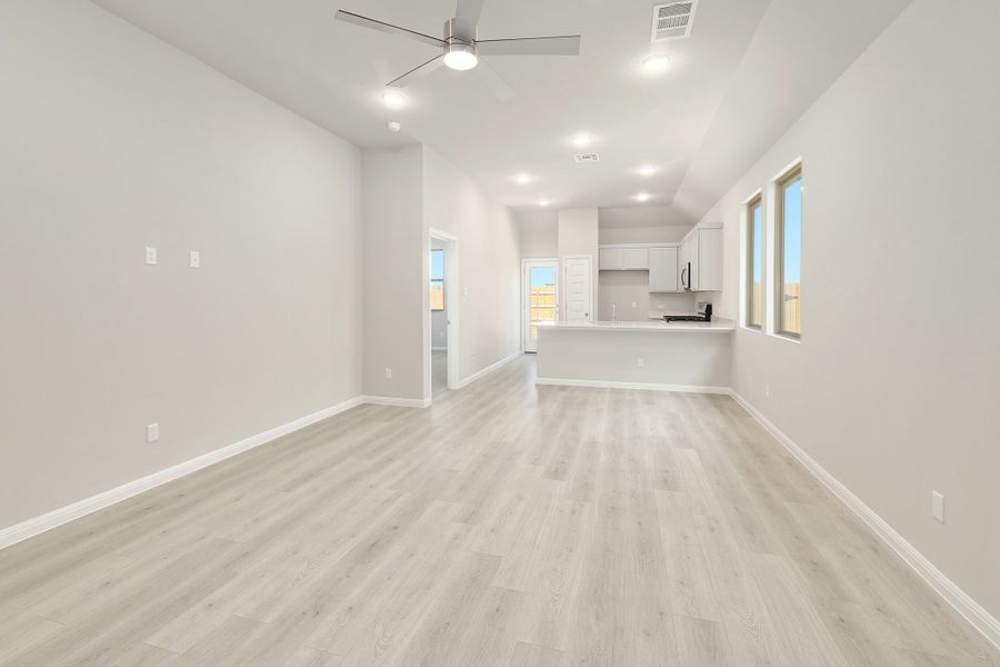 Living and Dining Area in the Ash home plan by Trophy Signature Homes – REPRESENTATIVE PHOTO