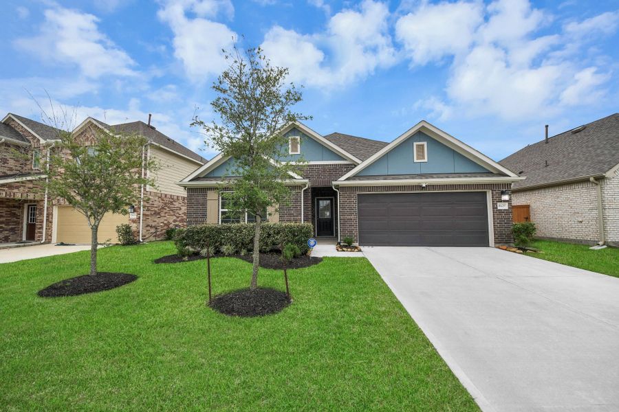 Front exterior of a new home in Marvida, Cypress, TX, highlighting curb appeal (Image 24).