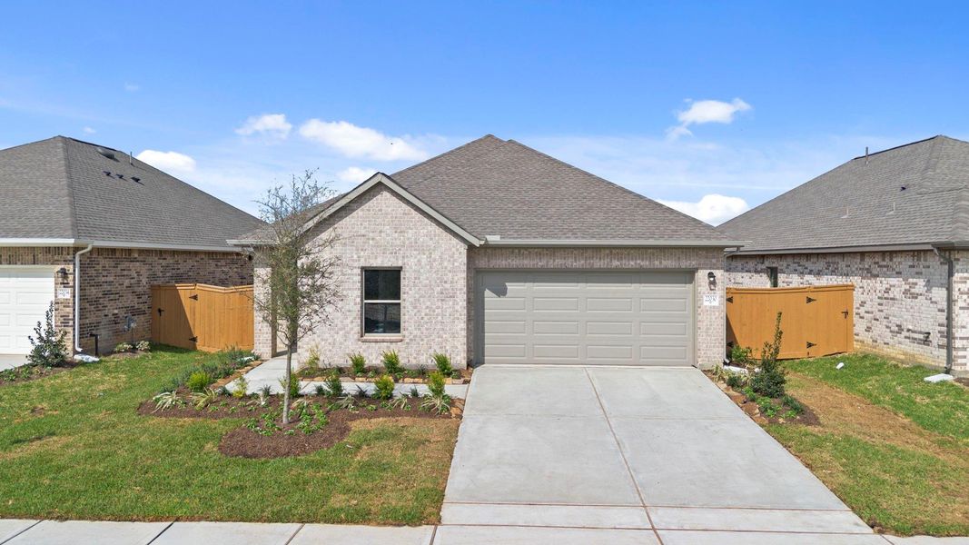 Front exterior of a new home in Cypress Green, Hockley, TX, highlighting curb appeal (Image 20).