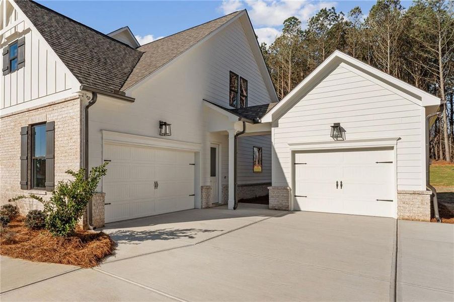 Front exterior of a new home in The Reserve at Knollwood, Canton, GA, highlighting curb appeal (Image 22).