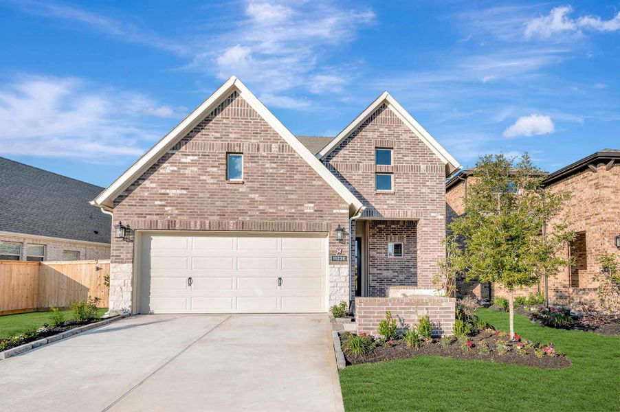 Representative exterior photo of a completed home built from the The Marshall by David Weekley Homes in The Highlands - Grove Collection, Porter, TX (Image 1). Representative exterior photo of a completed home built from the The Marshall by David Weekley Homes in The Highlands - Grove Collection, Porter, TX (Image 1).