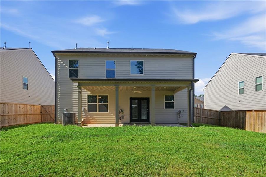 Exterior details and patio area of a home in The Enclave at Flat Rock Hills, Stonecrest (Image 3).