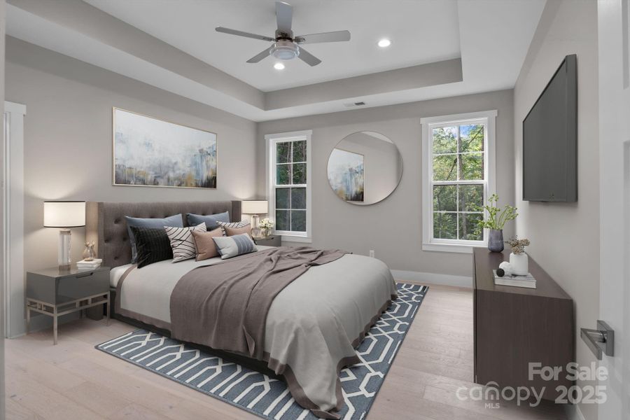 Virtually staged to highlight a spacious and luxurious primary bedroom suite