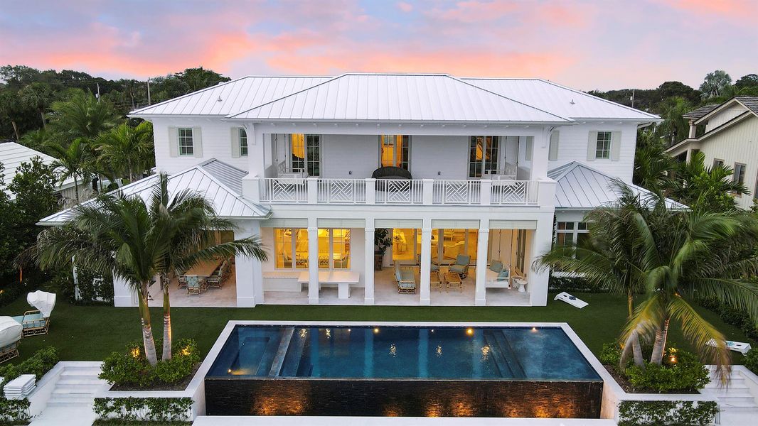 Front exterior of a new home in , North Palm Beach, FL, highlighting curb appeal (Image 27). Front exterior of a new home in , North Palm Beach, FL, highlighting curb appeal (Image 27).