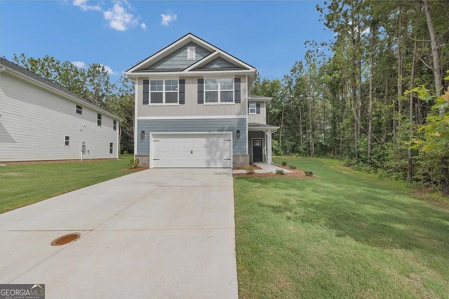 Front exterior of a new home in Canterbury Villas, Carrollton, GA, highlighting curb appeal (Image 1). Front exterior of a new home in Canterbury Villas, Carrollton, GA, highlighting curb appeal (Image 1).