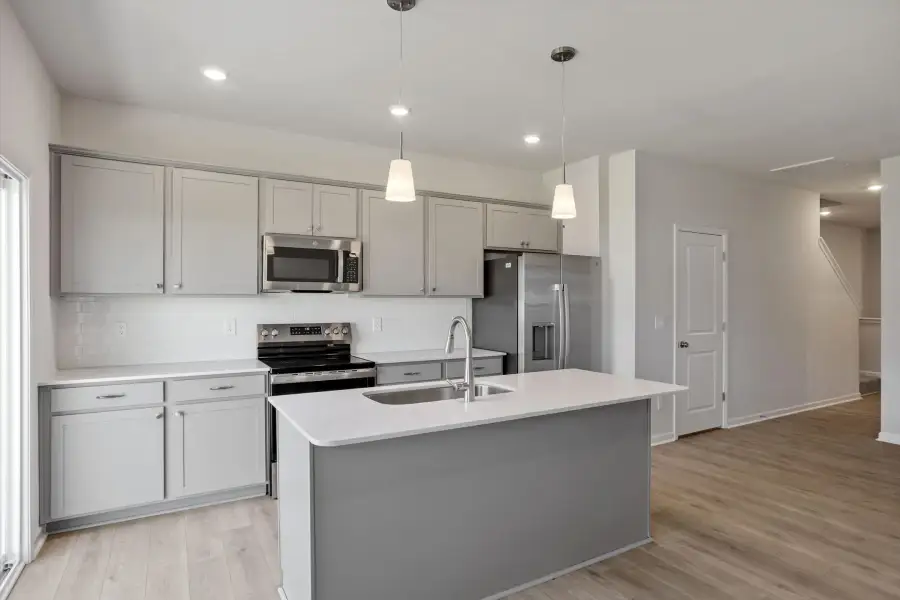Furnished interior view inside a new home in West Main Townhomes, Sanford (Image 8).