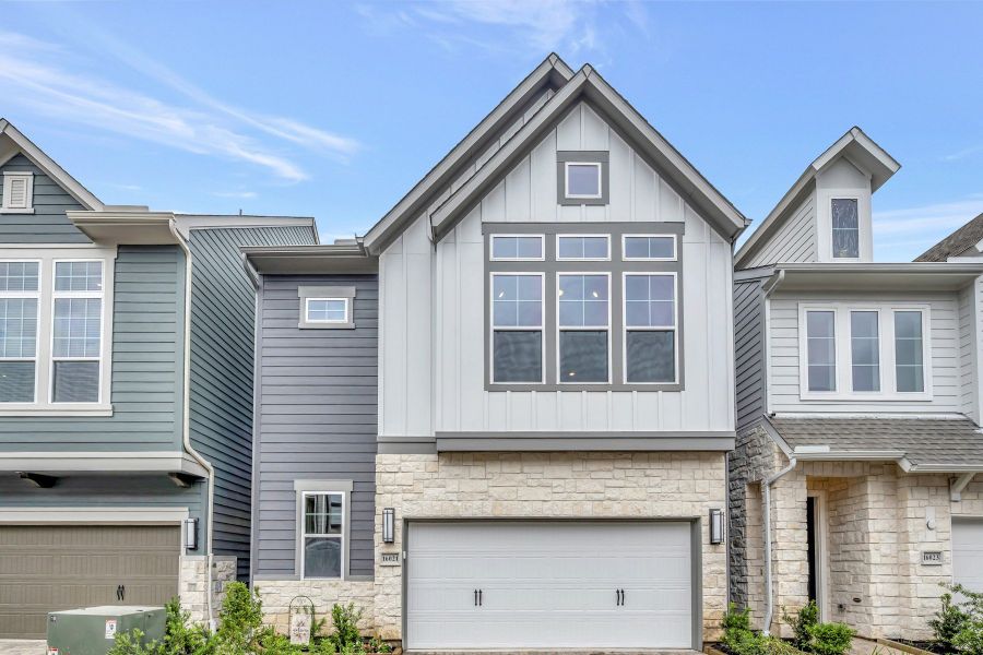 Front exterior of a new home in Retreat at Oak Park, Houston, TX, highlighting curb appeal (Image 22).