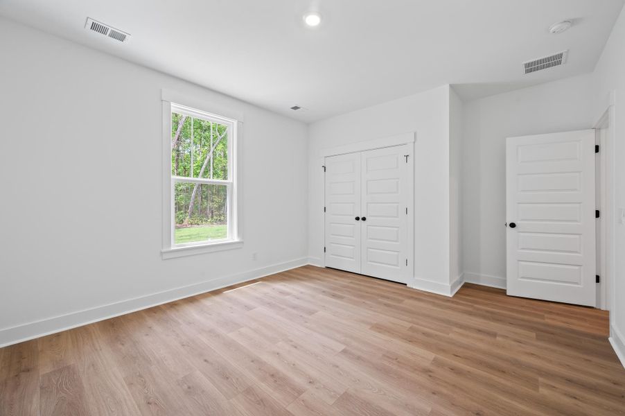 Spacious, unfurnished interior of a new home in Long Bay Golf Club, Longs (Image 30).