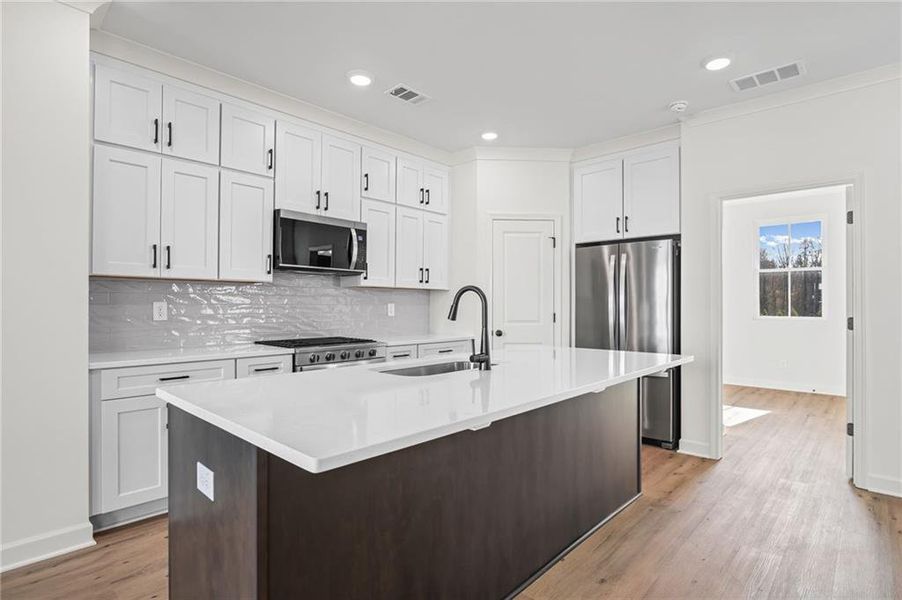 Furnished interior view inside a new home in The Village at River Green, Canton (Image 12).
