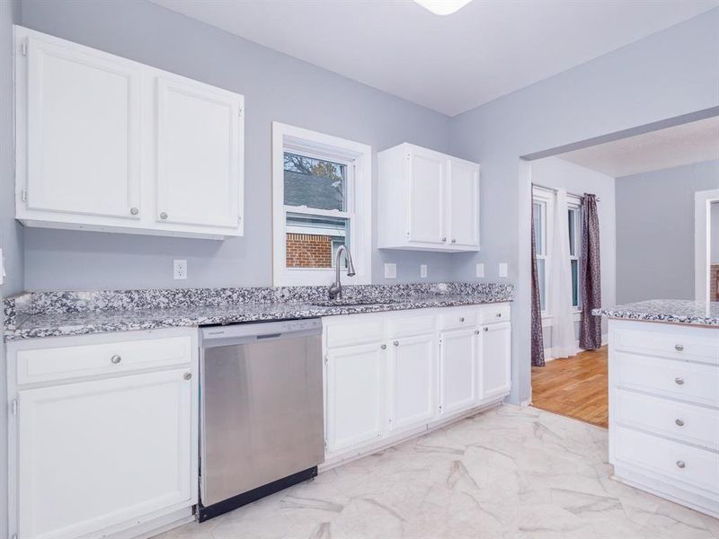 The kitchen offers expanded granite countertops and lots of cabinets and drawers