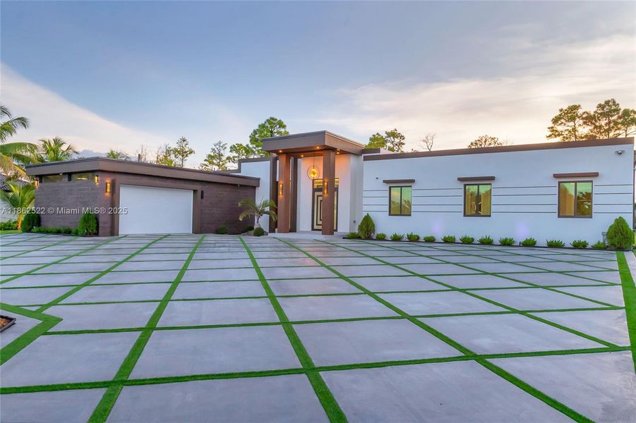 Front exterior of a new home in , Homestead, FL, highlighting curb appeal (Image 25).