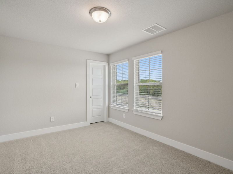 Secondary Bedroom in the Medina floorplan at a Meritage Homes community. Secondary Bedroom in the Medina floorplan at a Meritage Homes community.