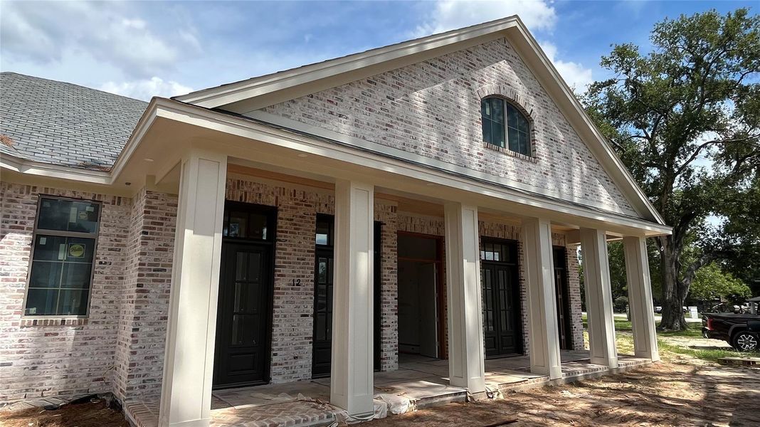 A progress photo in August 2025 showing the completed exterior envelope of the home.
