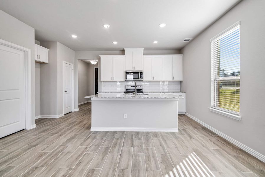 Representative furnished interior of a home built from the The Tulip by Lillian Custom Homes in The Preserve, Sherman (Image 11).