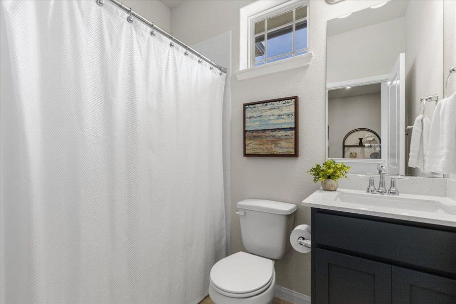 The second full bath is well-appointed for the second bedrooms use.