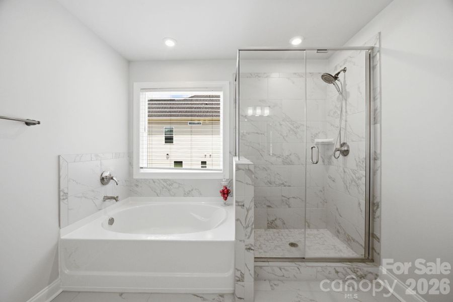 Primary en-suite with tub and shower.