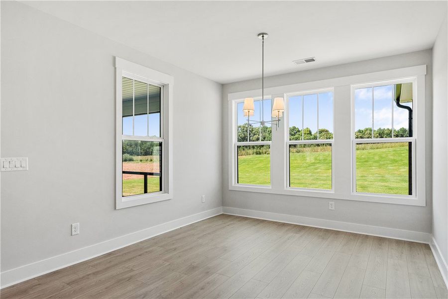 A well-lit interior space with light-toned floorin A well-lit interior space with light-toned floorin