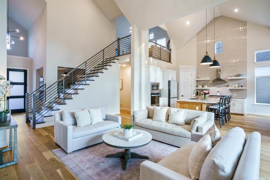 Designer Vision Realized - The view from the living room reveals the full architectural drama of this home—from floating stairs to the chef’s kitchen beyond. Every angle offers clean lines, modern materials, and purposeful flow. Designer Vision Realized - The view from the living room reveals the full architectural drama of this home—from floating stairs to the chef’s kitchen beyond. Every angle offers clean lines, modern materials, and purposeful flow.