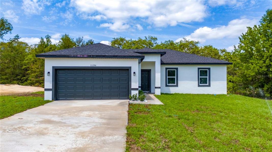 Front exterior of a new home in , Ocala, FL, highlighting curb appeal (Image 14).