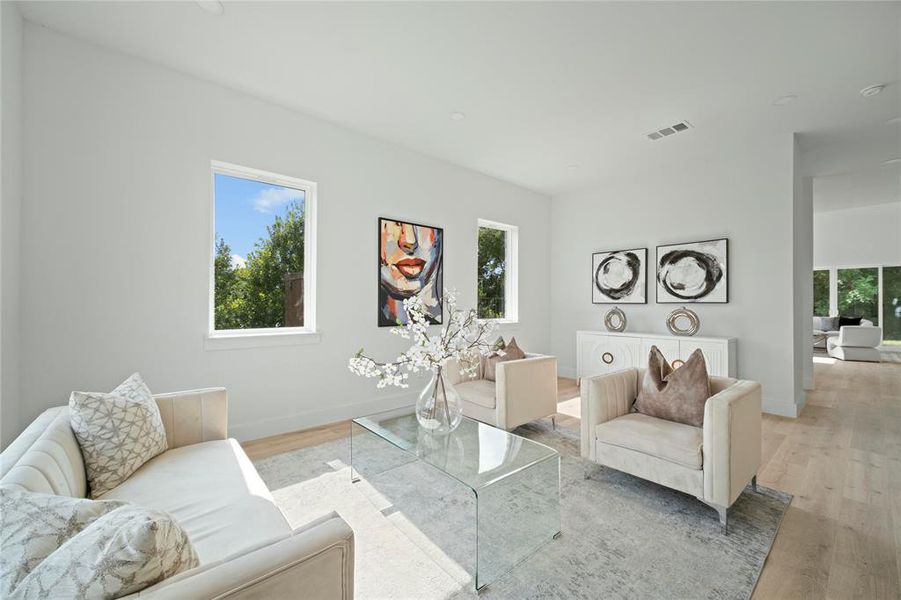 Living area with light wood-type flooring Living area with light wood-type flooring