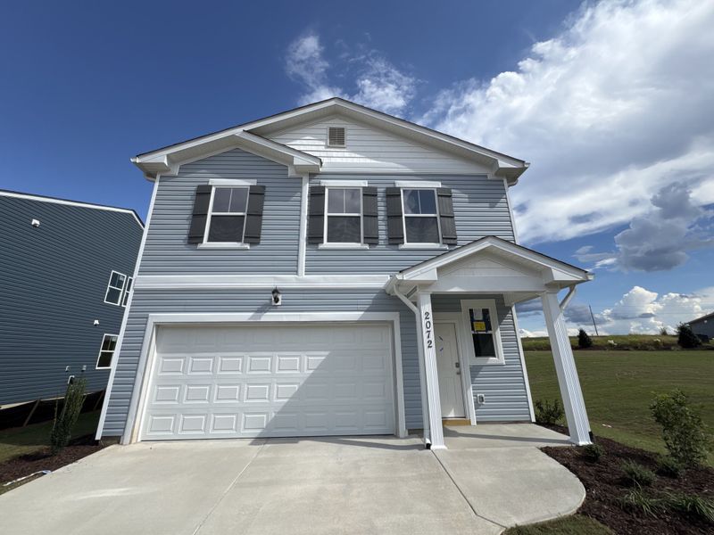Front exterior of a new home in Declaration Homes at Tillery Park West, Grovetown, GA, highlighting curb appeal (Image 11). Front exterior of a new home in Declaration Homes at Tillery Park West, Grovetown, GA, highlighting curb appeal (Image 11).
