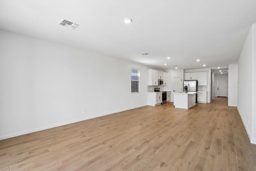 Great room, dining and kitchen Great room, dining and kitchen