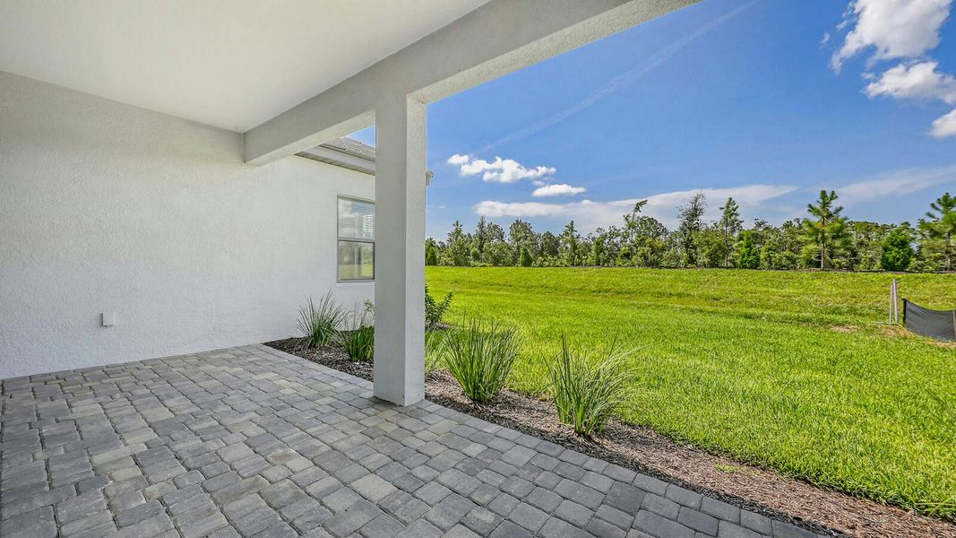 Exterior details and patio area of a home in Palm Grove Real Estate and Homes for Sale in Lakewood Ranch, FL - Neal Communities, Lakewood Ranch (Image 4).