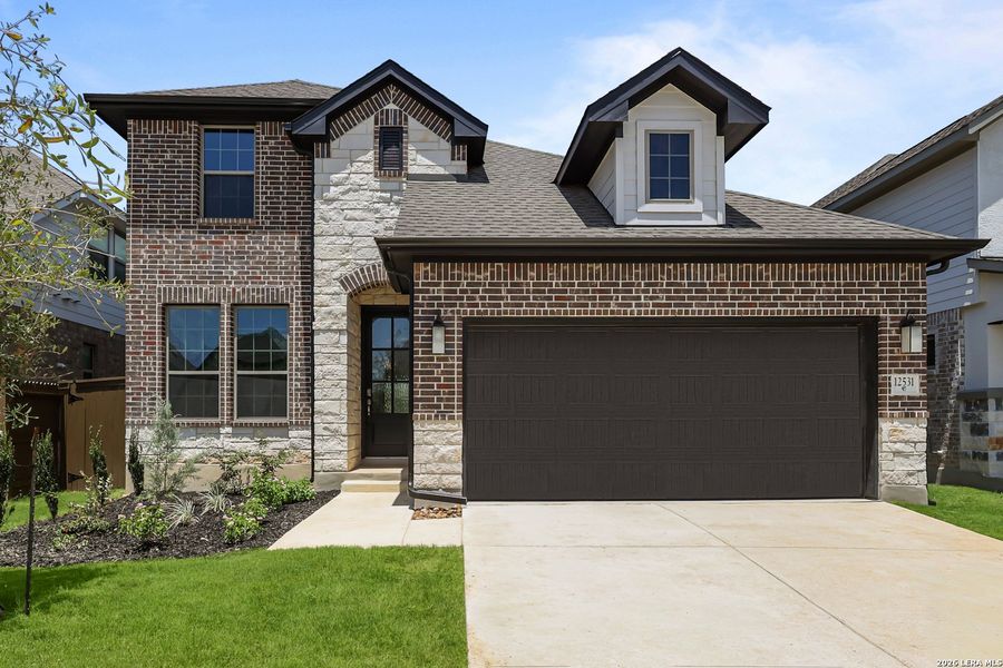 Front exterior of a new home in Stillwater Ranch, San Antonio, TX, highlighting curb appeal (Image 25).