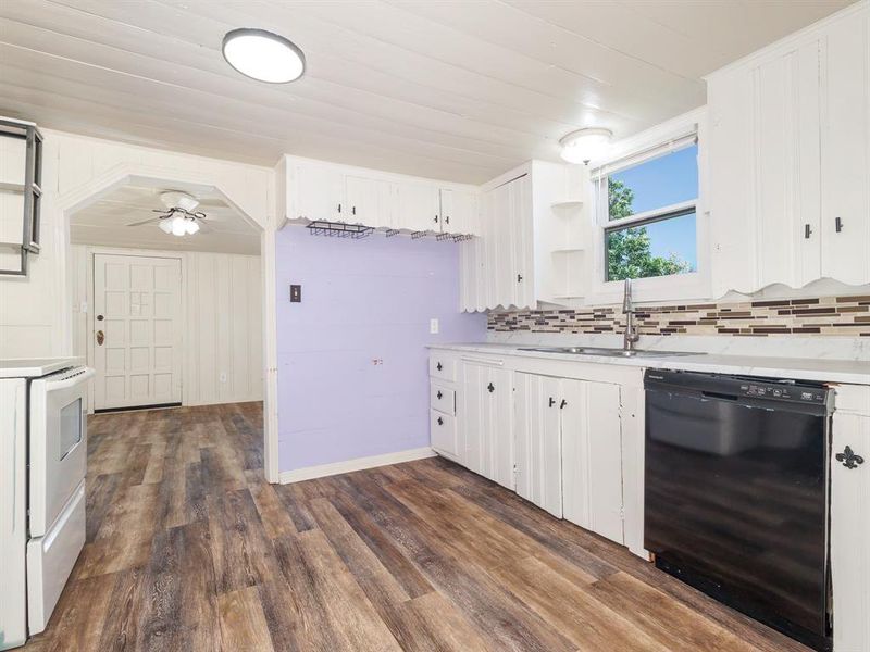 Great kitchen with dishwasher, stove, refrigerator will convey on request.