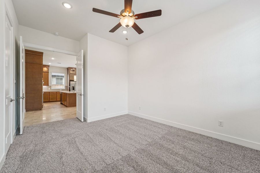 Representative unfurnished interior of a home built from the Lauren by Chesmar Homes in University Heights, Round Rock (Image 14).